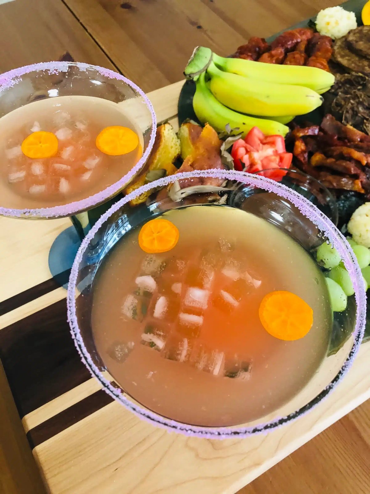 Rose and calamansi cocktails in sugar-rimmed glasses